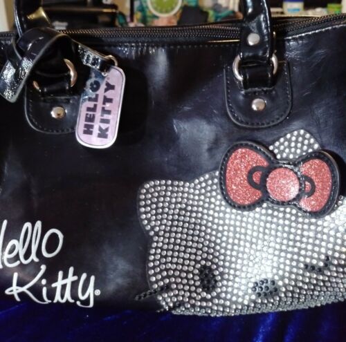 HELLO KITTY.                 Black glossy Handbag in Excellent condition.